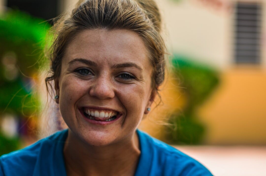 Studio portrait of a Slovenian woman speech coach smiling
